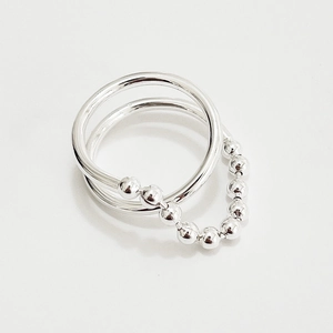 Minimalist 925 sterling silver ring featuring a smooth band and beaded chain link design