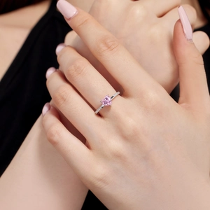 Close-up of S925 silver ring featuring pink heart gemstone and pavé zircon stones