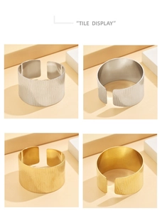 Detailed tile display of wide C-shaped stainless steel bracelets in gold and silver finishes