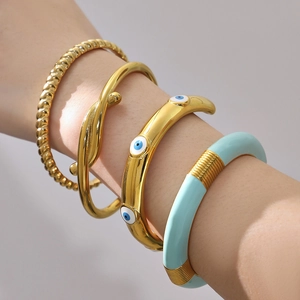 Set bracciali rigidi in acciaio inossidabile dorato con occhio smaltato blu