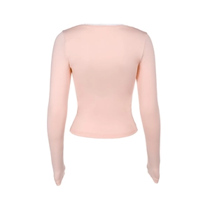 Detail of light pink slim-fit top featuring white lace trim on the square neckline