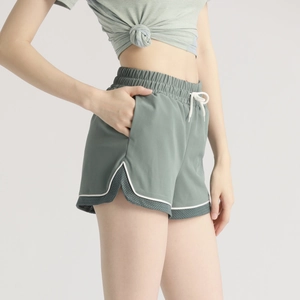 Women's 2-in-1 sports shorts in sage green with drawstring waist and mesh panels