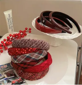 Detail of assorted autumn winter headbands in burgundy red and tweed textures
