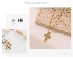 Close-up of a gold cross pendant necklace with micro-pave zircons and aesthetic styling