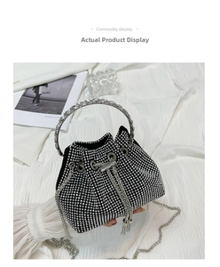 Detail of rhinestone evening bucket bag showing silver metal ring handle and chain strap