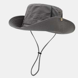 Detail of dark grey sun hat with side metal eyelets and adjustable windproof lanyard