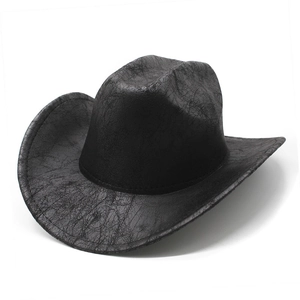 Vintage black distressed faux leather western cowboy hat with wide brim and cracked texture