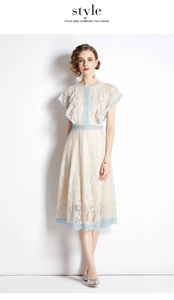Detail of floral lace trim and flutter sleeves on an elegant apricot midi dress