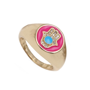 Golden open ring with pink enamel face featuring a blue crystal Hand of Fatima