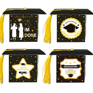 Detail of graduation cap gift boxes in four designs with yellow polyester tassels