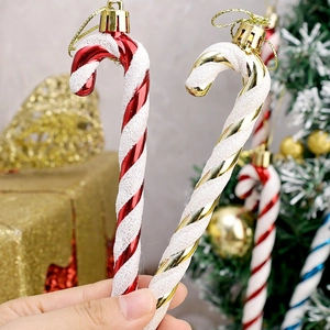 Christmas candy cane hanging ornaments in red white and gold glitter with gold strings
