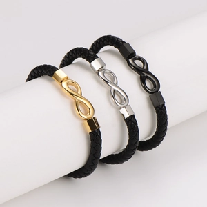 Three infinity braided leather bracelets in gold, silver and black on white display