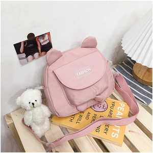 Pink canvas crossbody bag featuring cute animal ears and a stylish fashion label