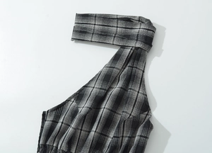 Detail shot of black and white plaid halter top neckline with premium stitching