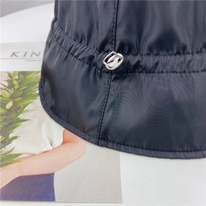 Women's black nylon bucket hat with adjustable silver metal buckle and drawstring detail