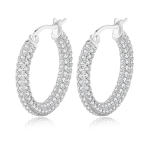 Macro detail of silver hoop earrings featuring multi-row pave-set white cubic zirconia stones