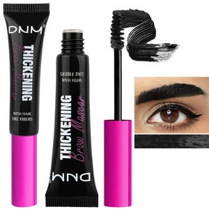 Detail of black fiber eyebrow mascara showing the brush head and natural finish effect