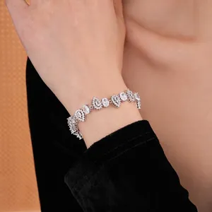 Elegant adjustable silver bracelet with sparkling teardrop and oval zircon stones on wrist