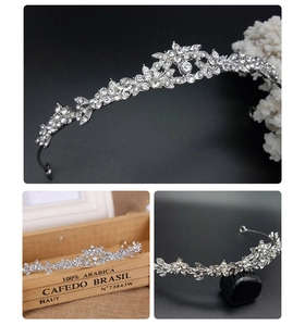 Macro detail of bridal silver tiara with floral alloy patterns and sparkling rhinestones