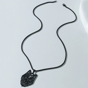 Close-up of a black stainless steel necklace with a hollow geometric wolf head pendant