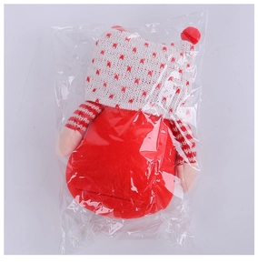 Close-up of a Christmas gnome plush toy in clear OPP packaging bag for protection