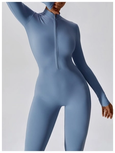 Close-up of light blue long-sleeve yoga bodysuit with front zipper and stand collar