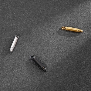 Three sleek bullet-shaped pendant necklaces in gold, silver, and black finish