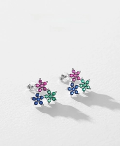 Macro shot of S925 sterling silver floral stud earrings with multi-color zircons