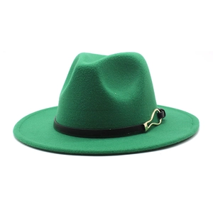 Detail of green wool fedora hat featuring a black leather band and gold horseshoe buckle