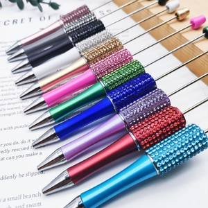 Detail of DIY beadable pens with sparkling rhinestone barrels in assorted vibrant colors