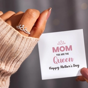 Detail of s925 silver crown ring with cubic zirconia and a Happy Mother's Day card