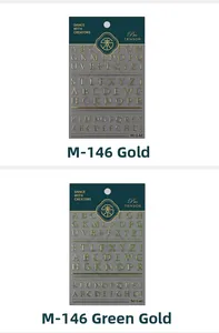Detail of M-146 3D metallic alphabet nail stickers in gold and green gold finishes