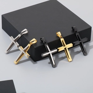 Detail showing five different colors of double-layered titanium steel cross pendants