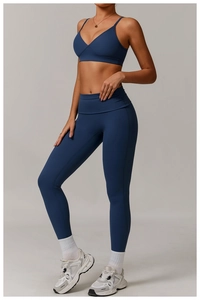 Detail of navy blue ribbed yoga set featuring V-neck sports bra and high waisted leggings
