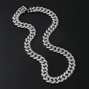 Silver iced out Cuban link necklace with S-shaped spring clasp on black background