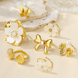 Set of 18k gold plated stainless steel rings featuring camellia flowers and pearl bows