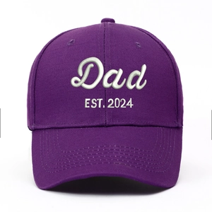 Washed purple baseball cap featuring white Dad EST. 2024 embroidery on front