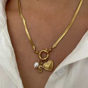 Gold snake chain necklace with pearl, letter S, and textured heart pendant for women