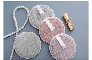 Close-up of colorful round bamboo carbon fiber makeup remover pads with hanging loops