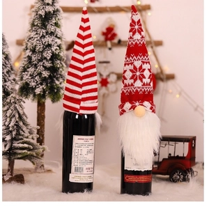 Christmas gnome wine bottle covers with striped hats and snowflakes for holiday decor