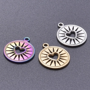 Detailed view of 18k plated stainless steel heart pendants in gold, silver and rainbow colors