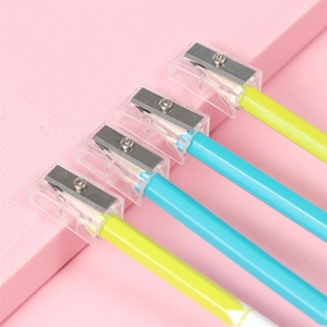 Close-up of yellow and blue pencils featuring silicone dolphin grip and built-in sharpener