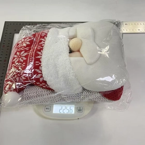 Detail of Santa Claus plush chair cover showing 225.6g weight on digital scale