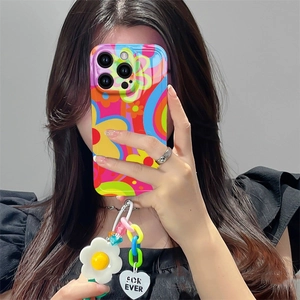 Detail of floral iPhone case with colorful flower and heart charm wrist strap handle