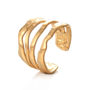 Irregular geometric wavy open ring with hammered gold texture in a minimalist design