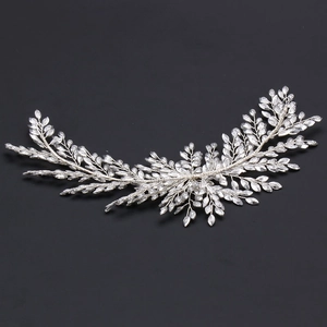 Detailed close-up of handmade bridal headband with silver wires and crystal beads