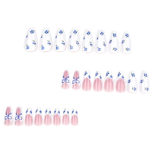 Blue and white French press-on nails with blueberry patterns and 3D bow accents