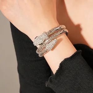 Silver snake wrap bracelet with pavé crystals on textured metal finish