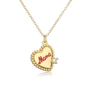 Detailed view of 18K gold heart pendant with red Mama script and sparkling zircon stone