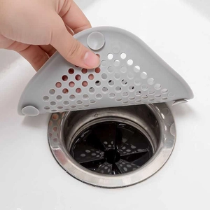 Gray silicone sink strainer with suction cups for hair filtering in kitchen and bathroom
